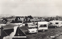Load image into Gallery viewer, Vintage black and white photo of caravans and tents at a campsite  
