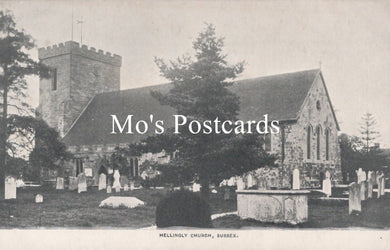 Vintage black and white postcard of a church with gravestones and trees