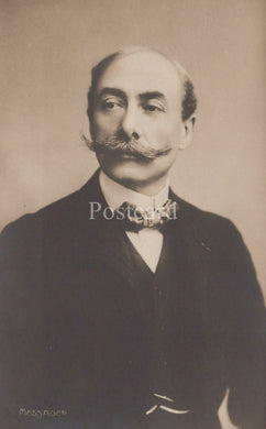 Vintage photograph of a man with a mustache wearing formal attire.