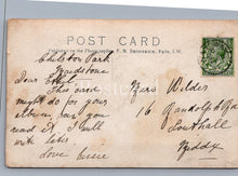 Load image into Gallery viewer, Vintage postcard with handwritten text and a stamp on a gray background
