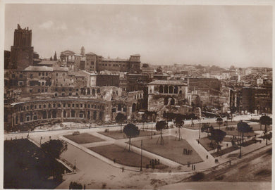 Vintage black and white photograph of a cityscape with historical buildings and a large open square.