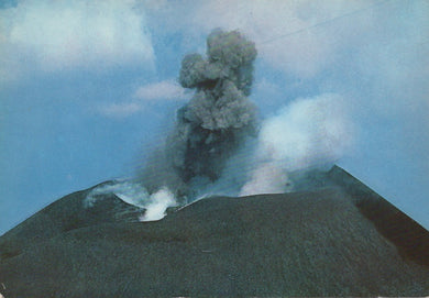 Volcano erupting with smoke and ash against a blue sky