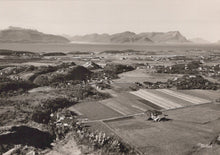 Load image into Gallery viewer, Vintage black and white photograph of a landscape with fields and mountains in the background
