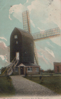 Vintage illustration of a windmill with a colorful sky