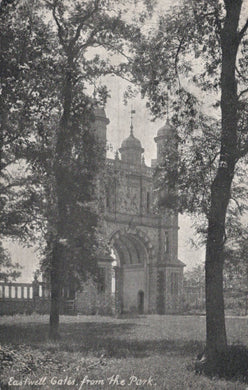 Vintage photograph of Eastwell Gates from the park, featuring a large archway with decorative elements.