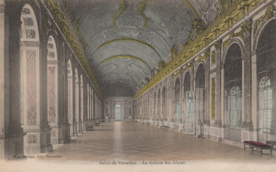 Long, ornate hallway with decorative ceiling in a palace interior.