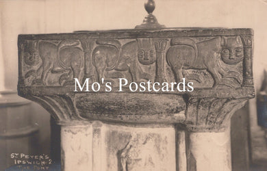 Decorative stone font with intricate carving 