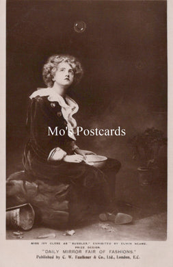 Vintage-style postcard with a woman sitting on the ground, wearing a dress and holding a pan