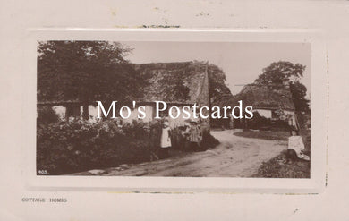 Vintage black and white photo of a cottage scene 