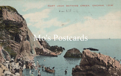 Vintage postcard of Port Jack Bathing Creek, Onchan, I.O.M. with people by the sea and cliffs.