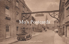 Load image into Gallery viewer, Vintage street scene with a car and buildings 
