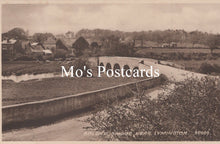 Load image into Gallery viewer, Vintage black and white postcard of a bridge over a river  
