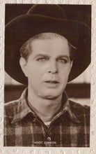 Load image into Gallery viewer, Vintage black and white photo of a man wearing a hat and plaid shirt with &#39;Hoot Gibson&#39; text.

