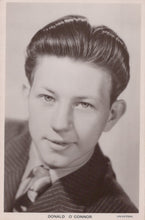 Load image into Gallery viewer, Vintage black and white portrait of a man with styled hair, wearing a suit.
