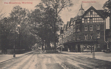 Vintage postcard of The Broadway in Worthing with a building on the right