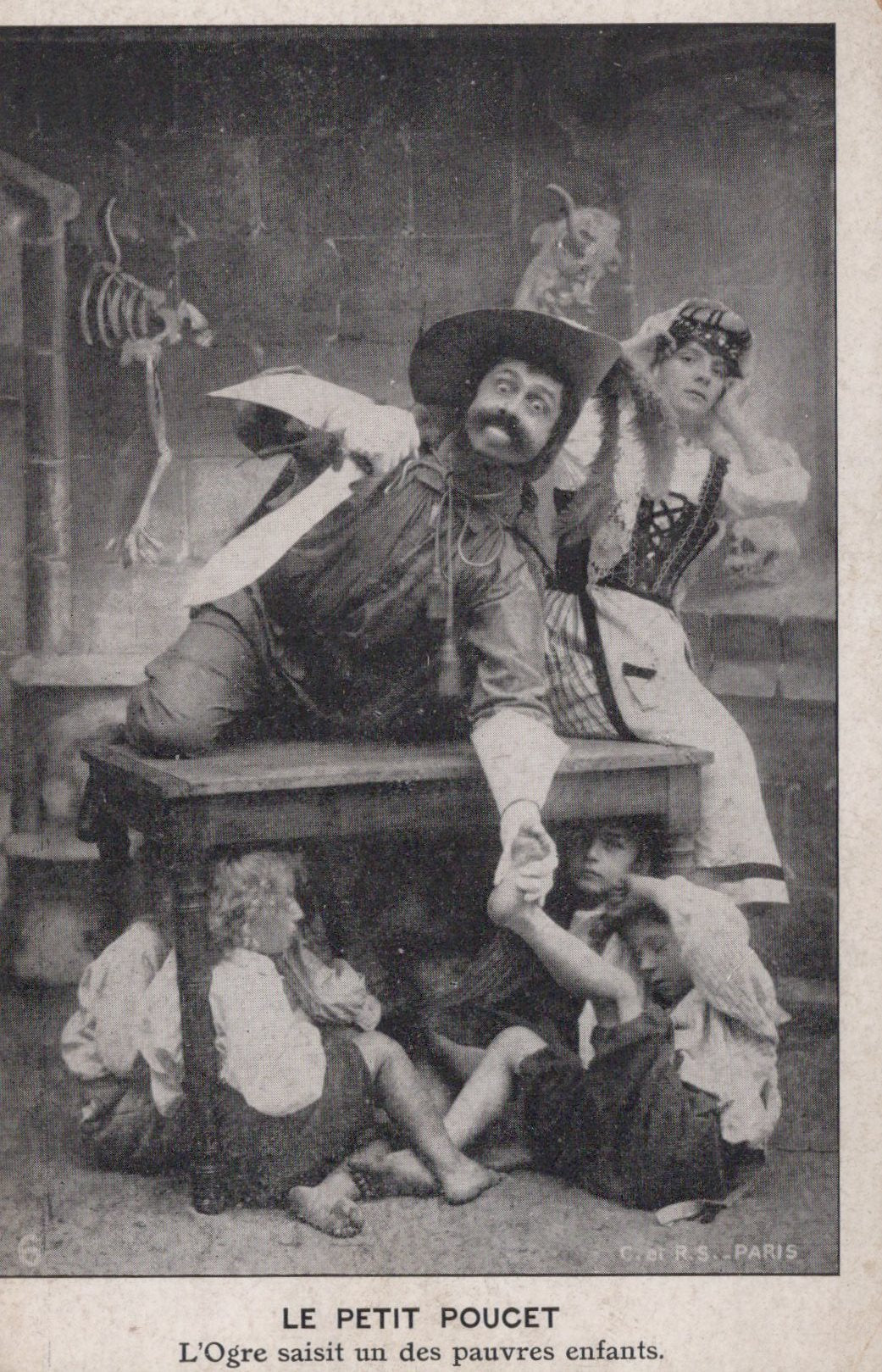 Vintage theatrical scene with actors in costumes, including a skeleton, in a dark setting.