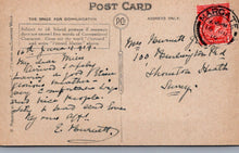 Load image into Gallery viewer, Vintage postcard with handwritten text and postage stamp, featuring a red cancel mark.
