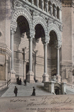 Architectural detail of a building with columns and steps, likely from a historical or vintage photograph.