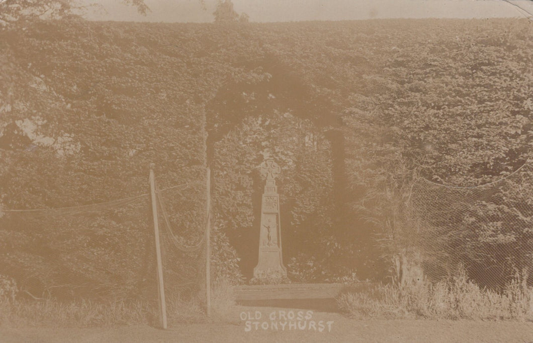 Monument in a field with 'Old Cross Stonehurst' text, sepia tone