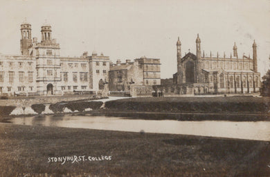 Historic black and white photograph of Stonyhurst College with buildings and a moat.