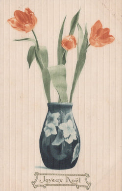 Decorative card with a blue vase holding red tulips on a striped background