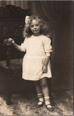 Ancestors Postcard - Young Girl Stood Next to an Ornate Wooden Chair  SW16846