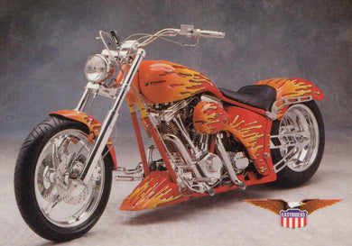 Orange motorcycle with flames on a gray background, featuring a brand logo.
