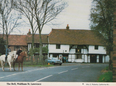 Traditional British pub with people on horseback and a car parked outside, featuring 'The Bell, Waltham St. Lawrence'.