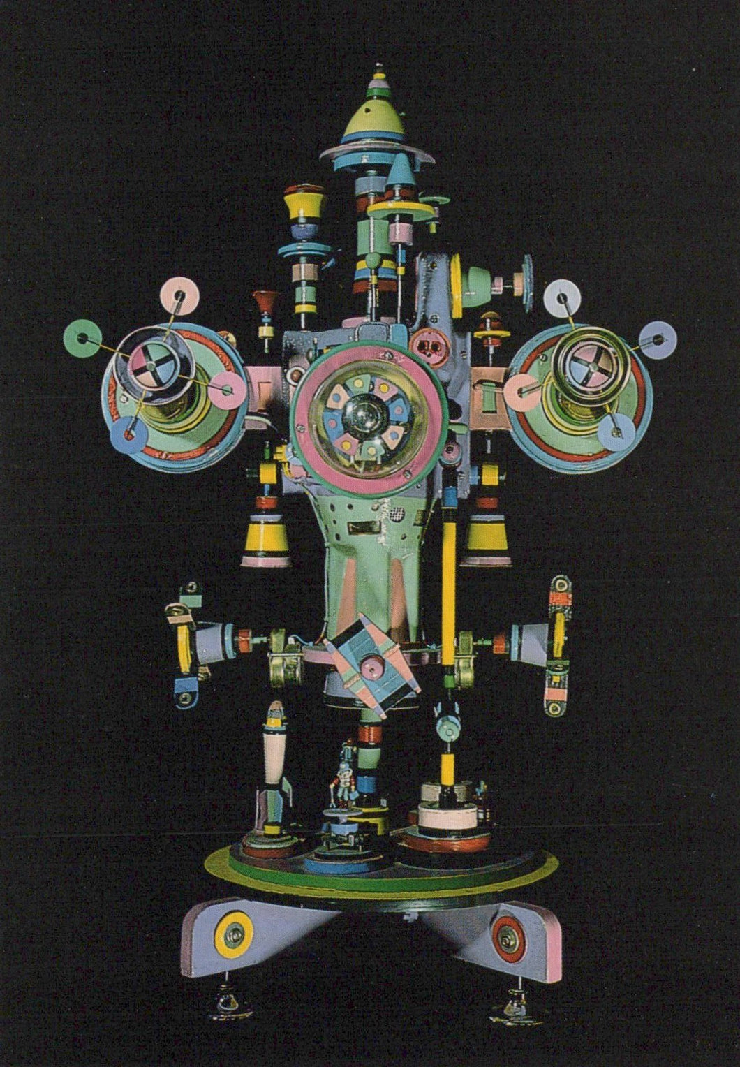 Colorful mechanical sculpture on a black background
