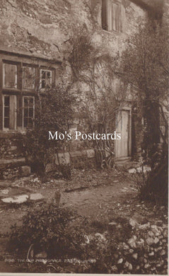 Vintage-style photo of a stone building with overgrown plants and 'Mo's Postcards' text overlay.