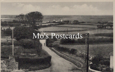 Vintage black and white photo of a rural landscape with a path and fields, featuring 'Mo's Postcards' text.