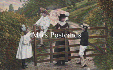 Vintage postcard with a family by a wooden gate in a garden, featuring the text 'Mo's Postcards'.