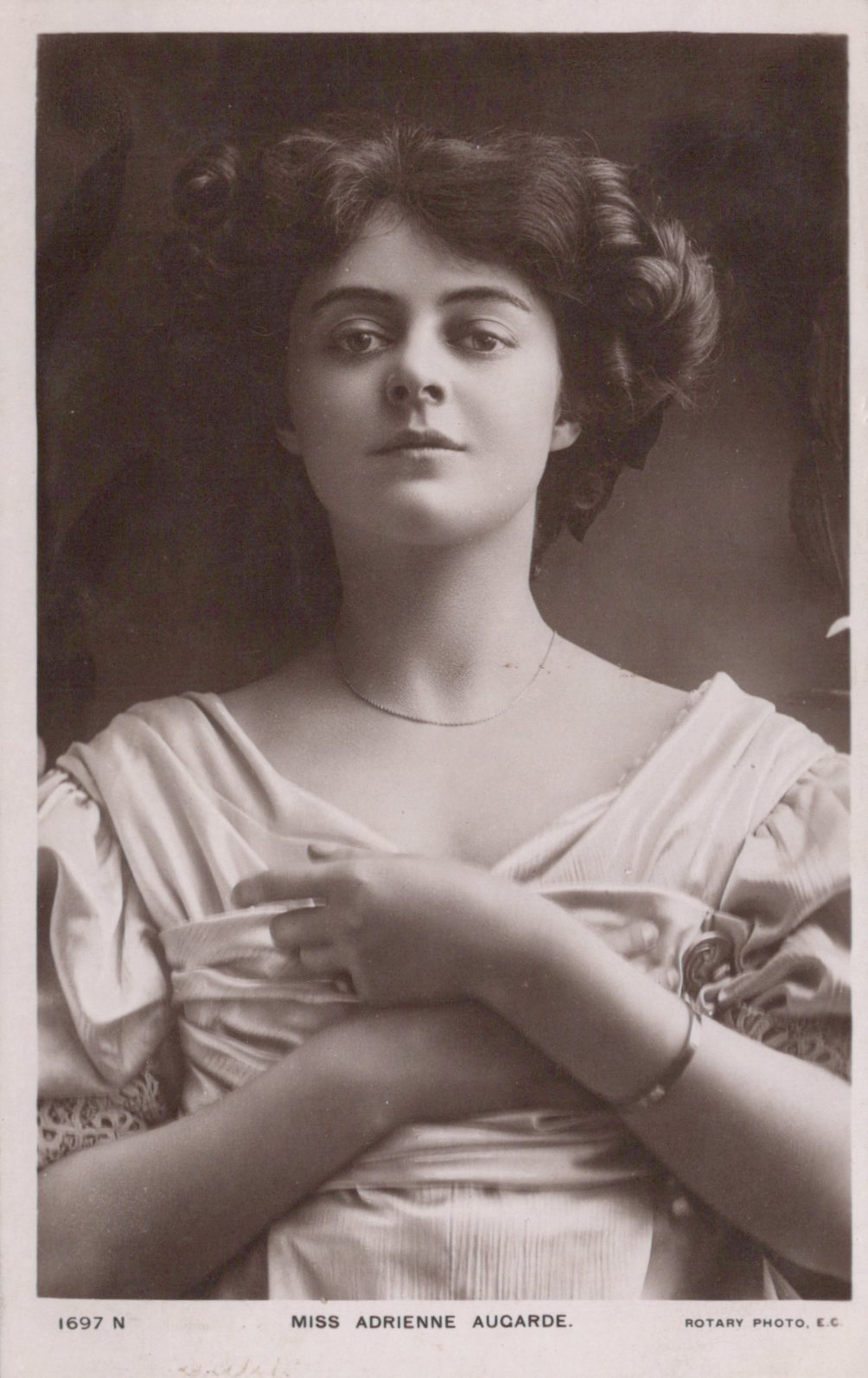 Vintage black and white portrait of a woman with a decorative headpiece