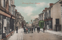 Load image into Gallery viewer, Vintage street scene in Helston with people and shops on Menage Street

