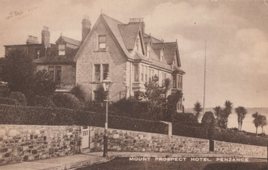 Vintage postcard of Mount Prospect Hotel in Penzance, featuring a large building with a street lamp and stone wall.