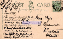 Load image into Gallery viewer, Vintage postcard with handwritten text and a stamp on a beige background

