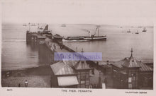 Load image into Gallery viewer, Vintage black and white postcard of a pier with boats and buildings, featuring &#39;Mo&#39;s Postcards&#39; branding.
