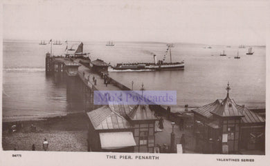 Vintage black and white postcard of a pier with boats and buildings, featuring 'Mo's Postcards' branding.