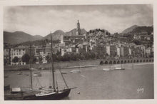 Load image into Gallery viewer, Vintage black and white photo of a coastal town with boats on the water
