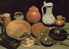 Load image into Gallery viewer, Collection of ancient pottery and utensils on a dark background
