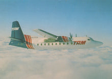 Load image into Gallery viewer, TAM airplane flying above clouds
