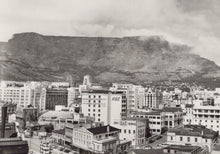 Load image into Gallery viewer, Vintage black and white photo of a cityscape with Table Mountain in the background
