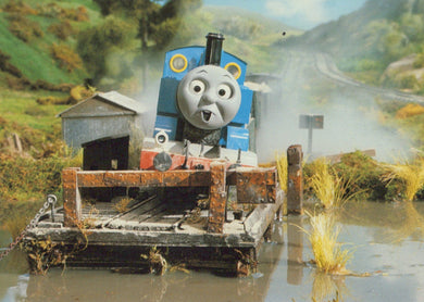 Animated character on a toy train set with a scenic background