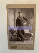 Load image into Gallery viewer, Vintage photo of a person in a sailor suit with decorative frame and watermark.
