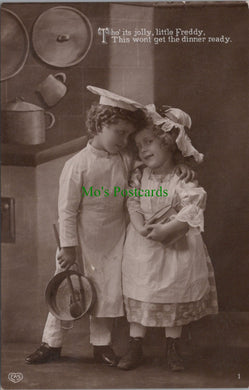 Two Children Dressed Up For Cooking